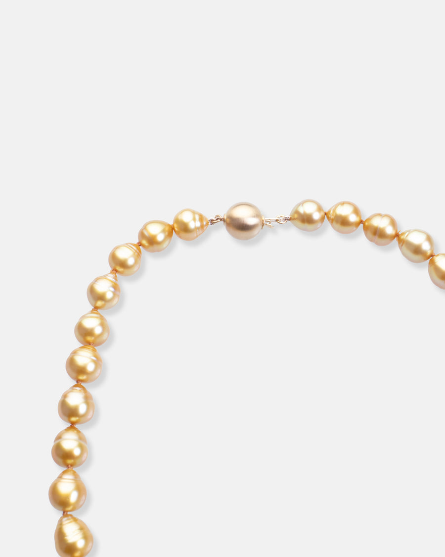 golden circled pearl necklace