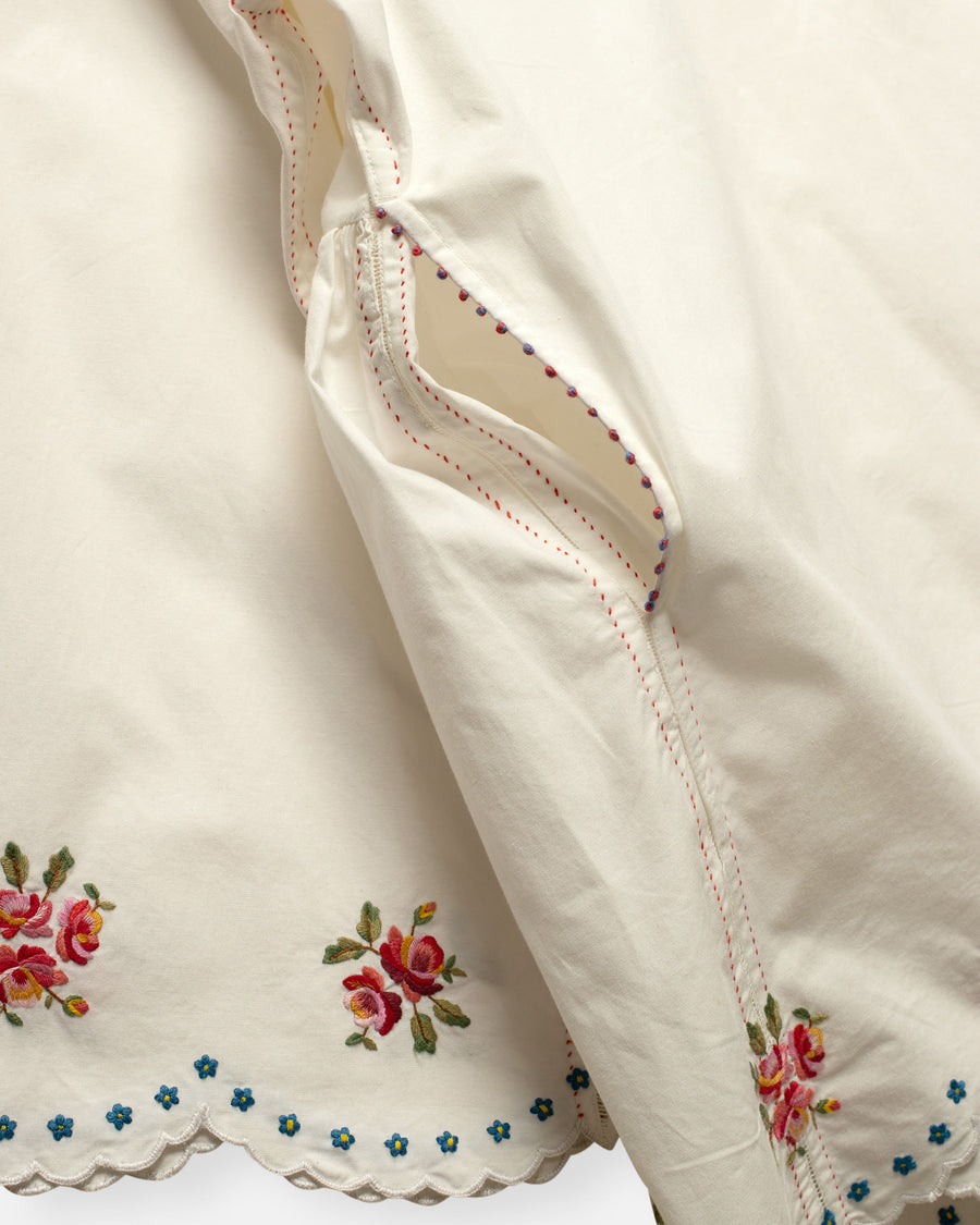 embroidered top with scallop edge