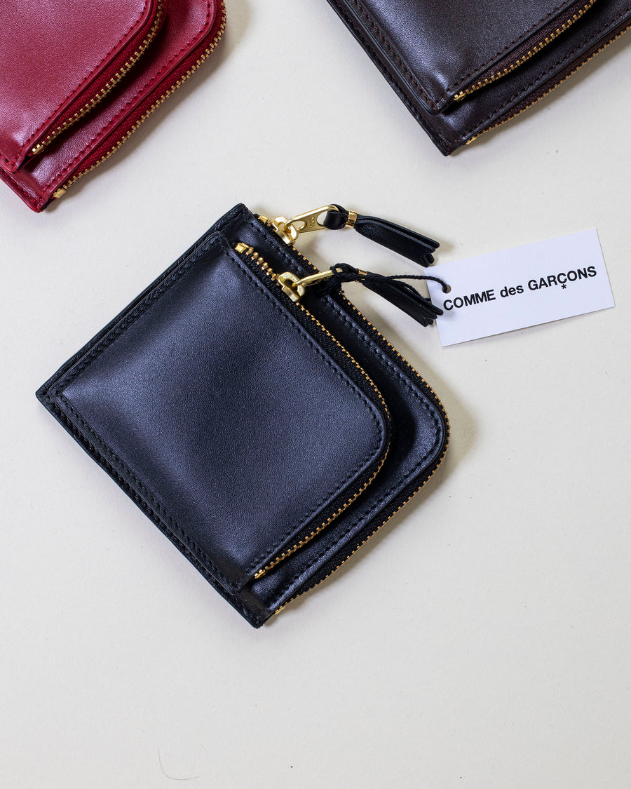 comme des garçons outside pocket half zip wallet